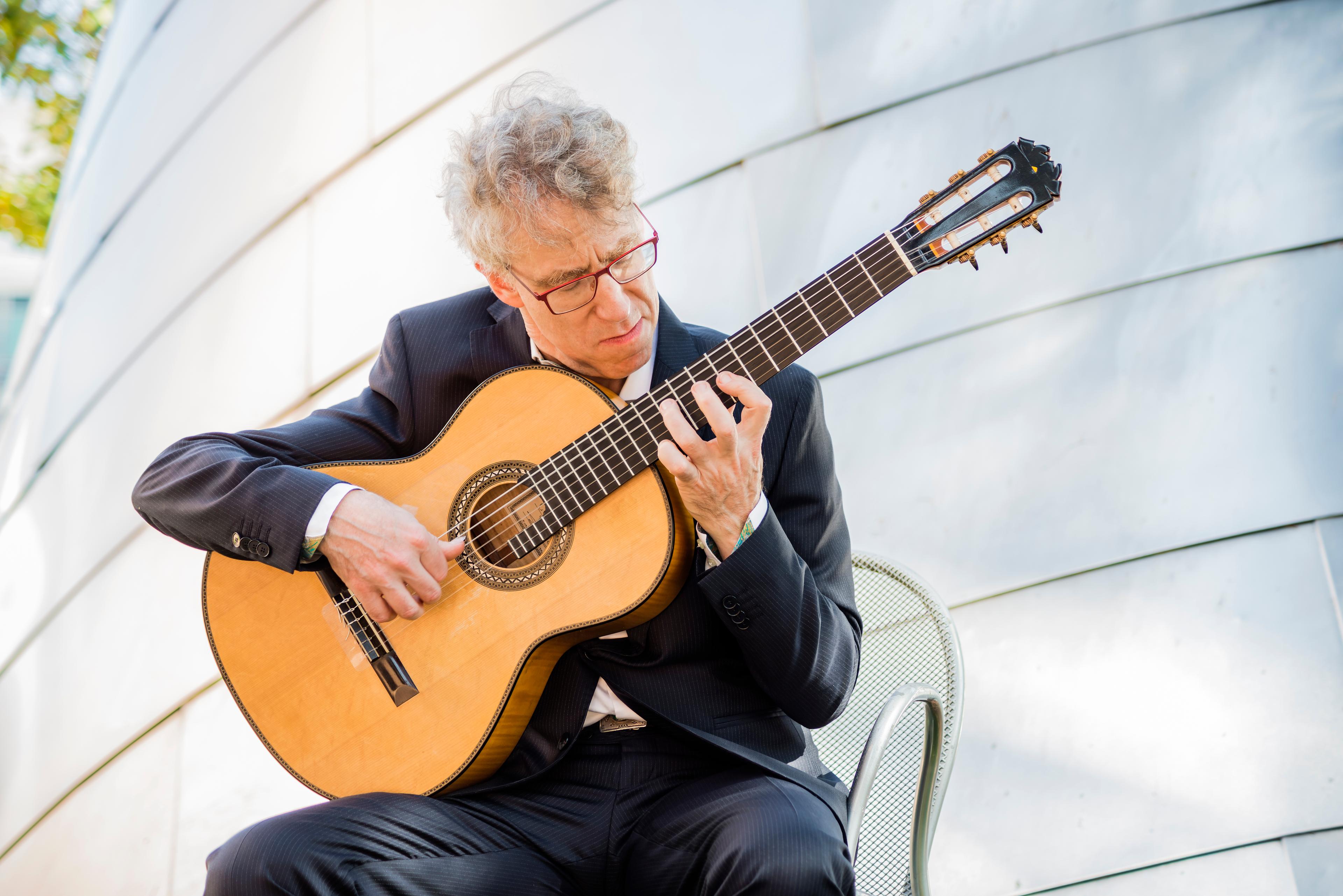 Eliot Fisk playing the guitar